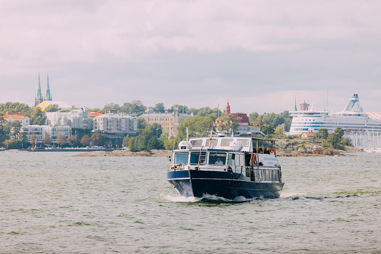 A boat is heading to an island off the coast of Helsinki.