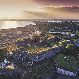 A bird's eye view of Suomenlinna Castle at sunrise.