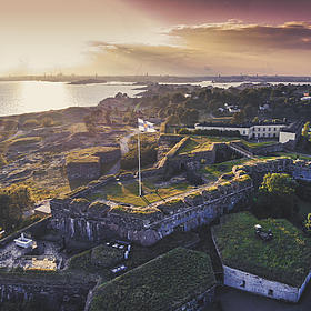 A bird's eye view of Suomenlinna Castle at sunrise.